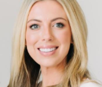 female employee against gray background